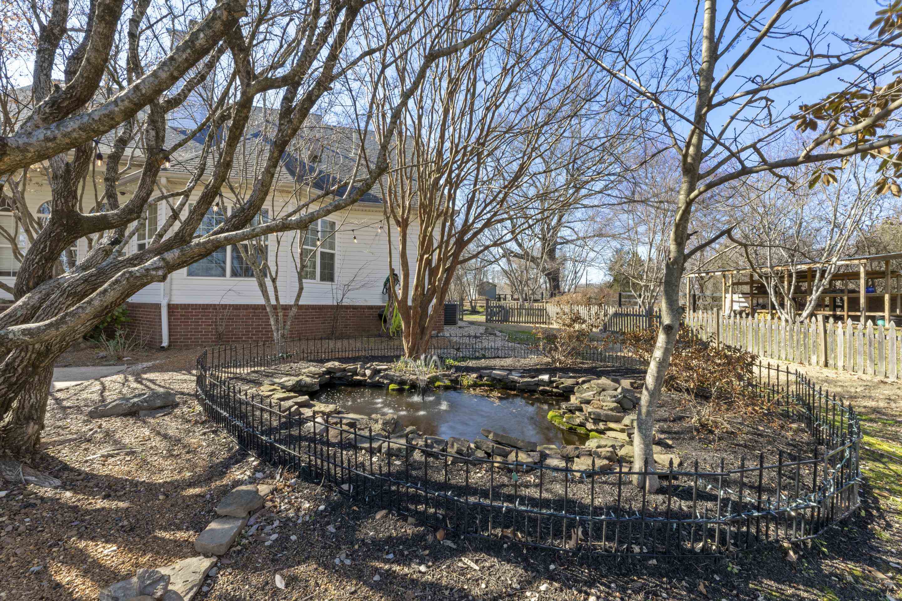 9650 Collierville Arlington Road Arlington, TN 38002 - Photo 24 of 39 View of yard featuring a garden pond