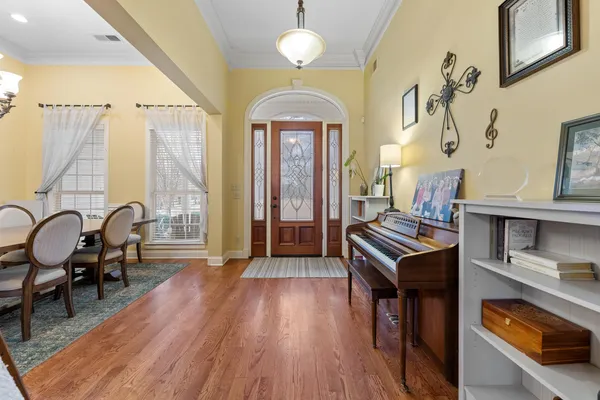 a view of a livingroom with furniture window and wooden floor