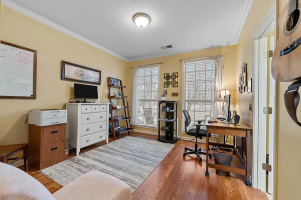 a bed room with a bed and a tv