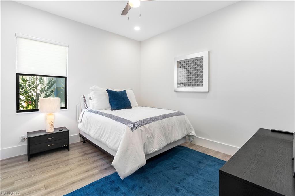 9675 Moonflower Court Naples, FL 34114 - Photo 21 of 32 Bedroom with wood finished floors, ceiling fan, and recessed lighting