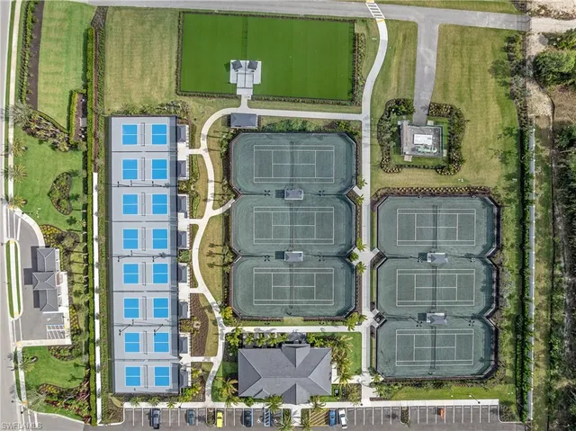 aerial view of a residential apartment building with a yard