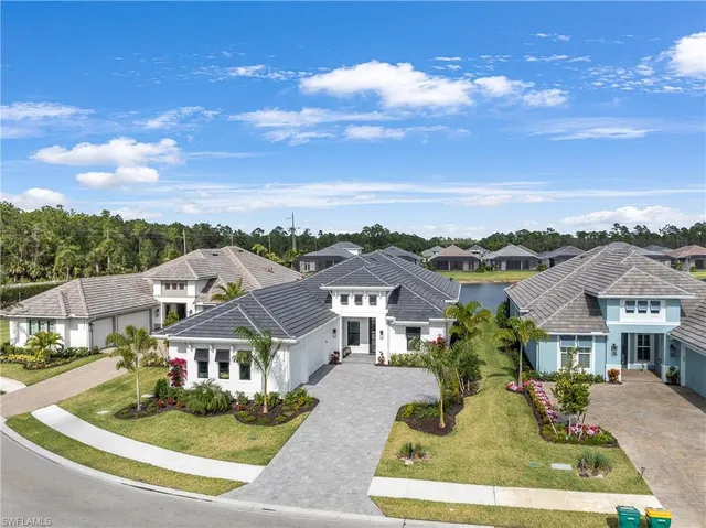 a aerial view of a residential apartment building with a yard