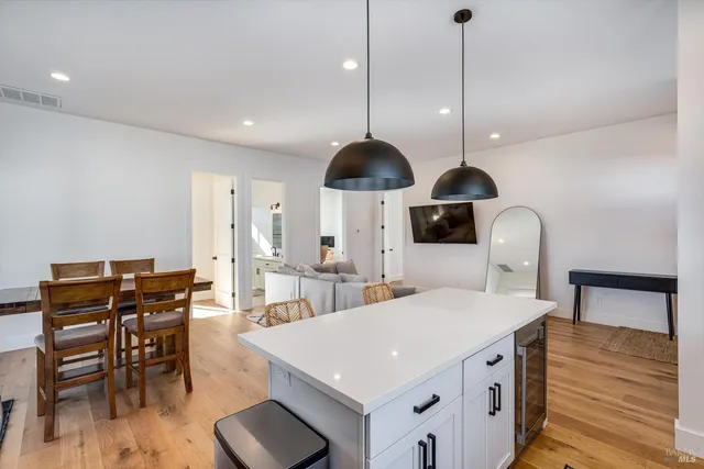 a bathroom with a shower sink and mirror
