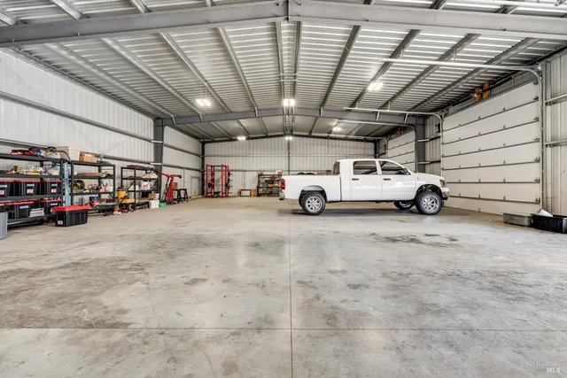 a backyard of house with wooden fence