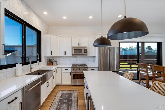 a view of a dining room with furniture window and outside view