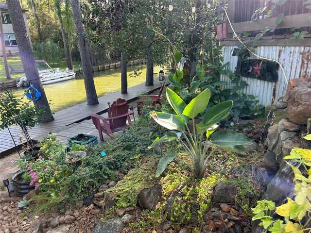a view of a backyard with swimming pool