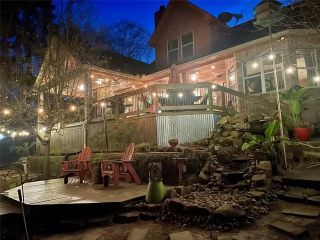 a view of a chairs and table in a patio