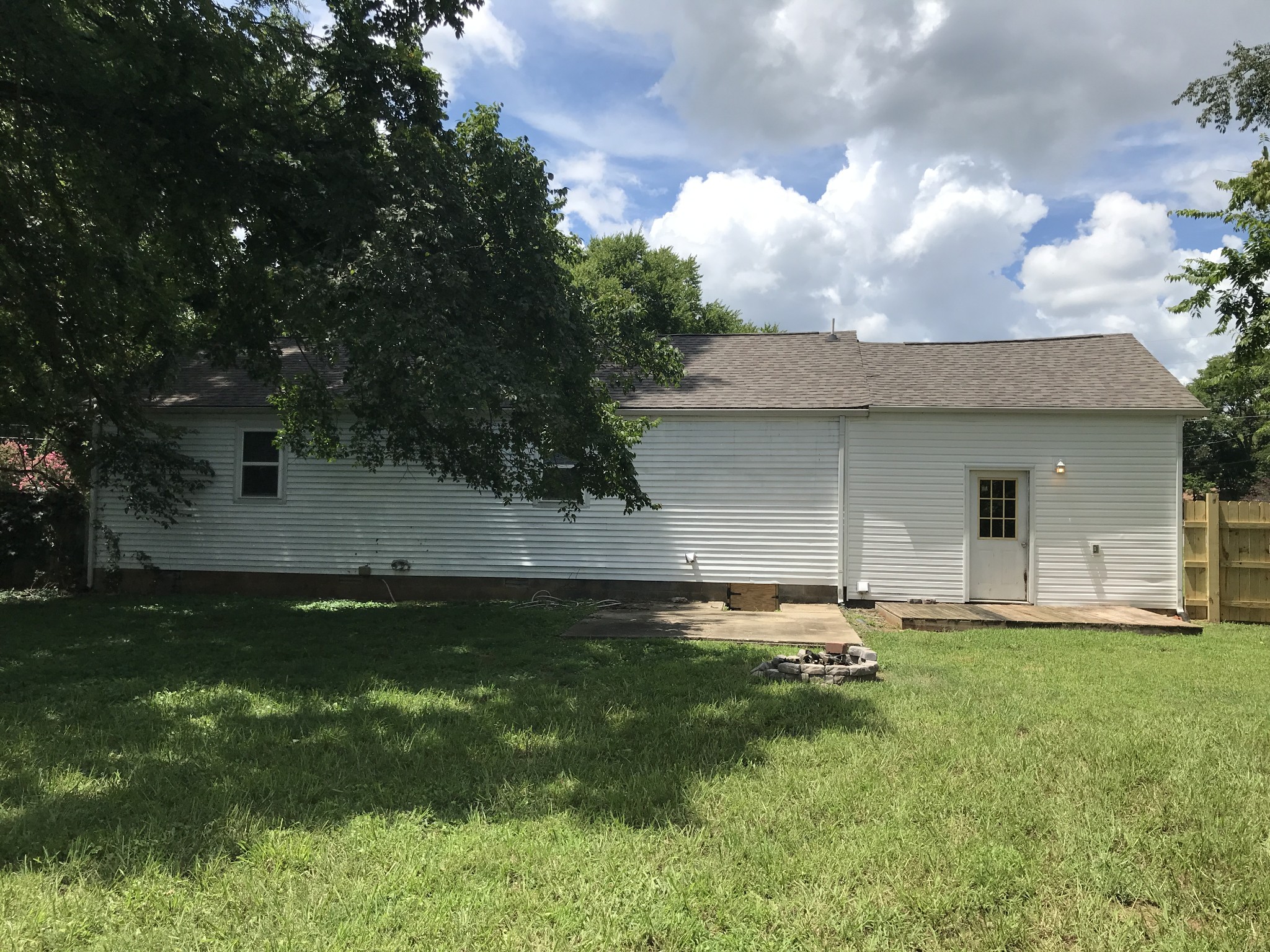 6558 Kari Drive Murfreesboro, TN 37129 - Photo 12 of 12 a backyard of a house with table and chairs