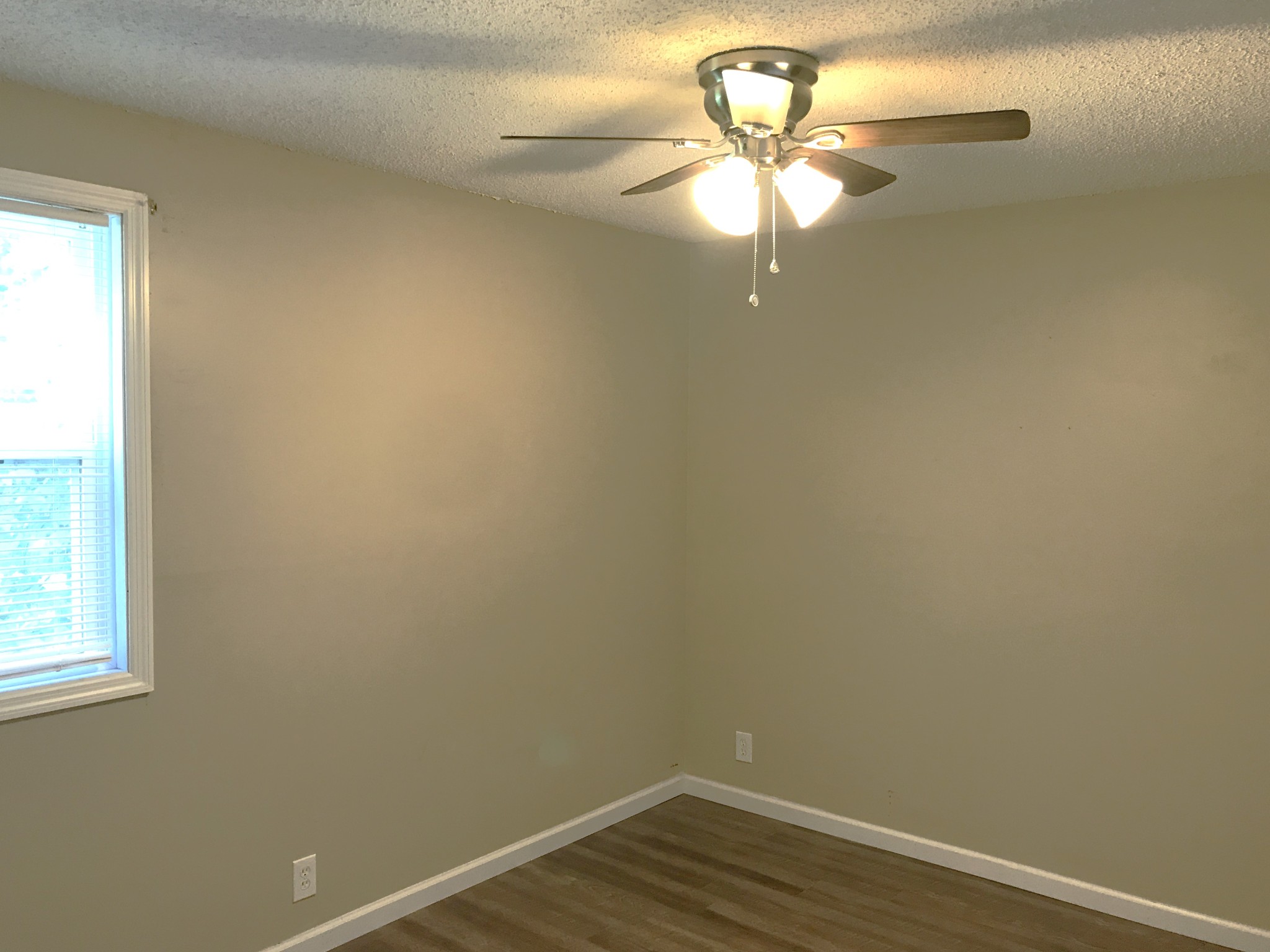 6558 Kari Drive Murfreesboro, TN 37129 - Photo 6 of 12 a view of a small space with wooden floor and a chandelier fan