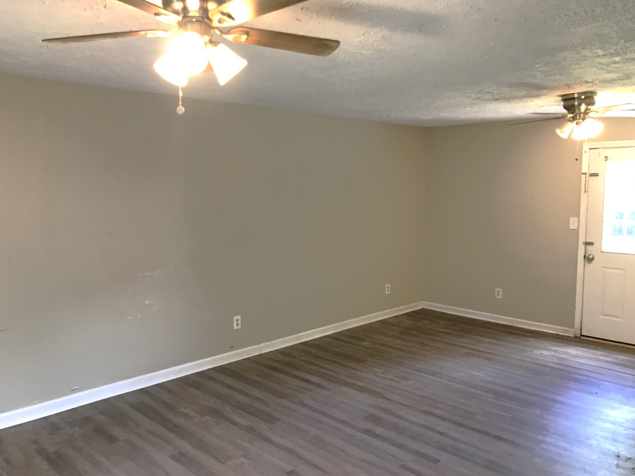 6558 Kari Drive Murfreesboro, TN 37129 - Photo 10 of 12 a view of an empty room with wooden floor and a window