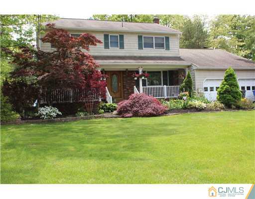 36 Runnymede Road Colonia, NJ 07067 - Photo 1 of 25 a front view of house with garden