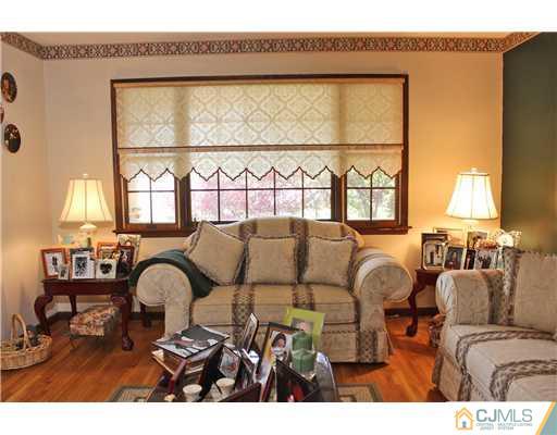 36 Runnymede Road Colonia, NJ 07067 - Photo 2 of 25 a living room with furniture and a large window