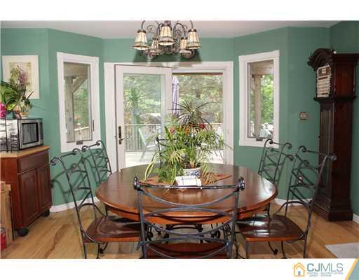 36 Runnymede Road Colonia, NJ 07067 - Photo 11 of 25 a view of a dining room with furniture window and outside view