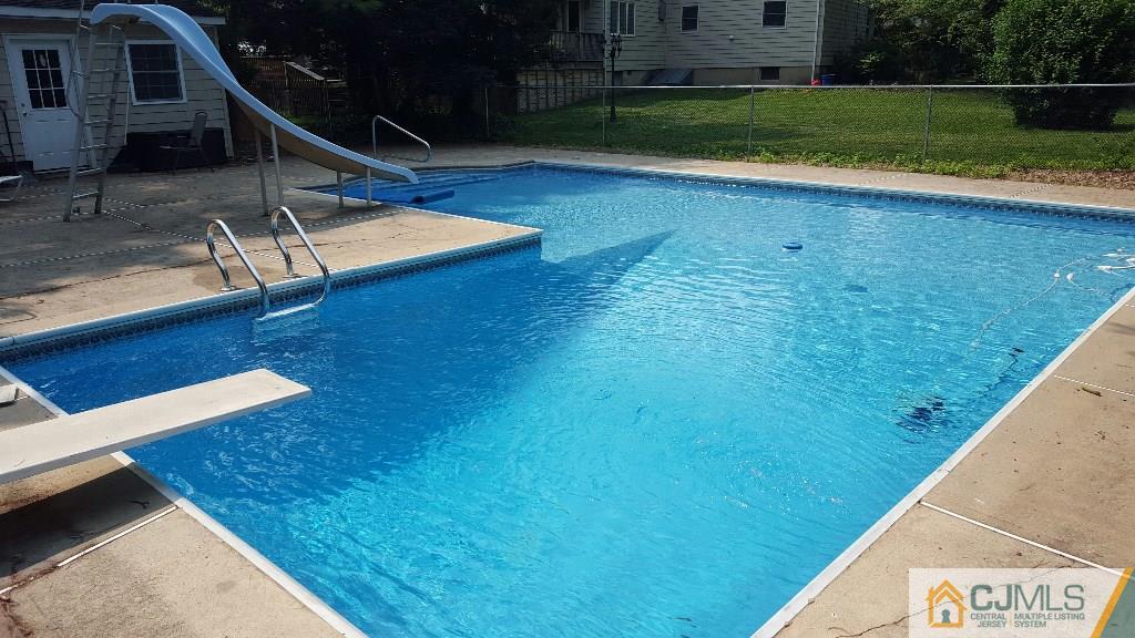36 Runnymede Road Colonia, NJ 07067 - Photo 23 of 25 a view of a pool with a yard