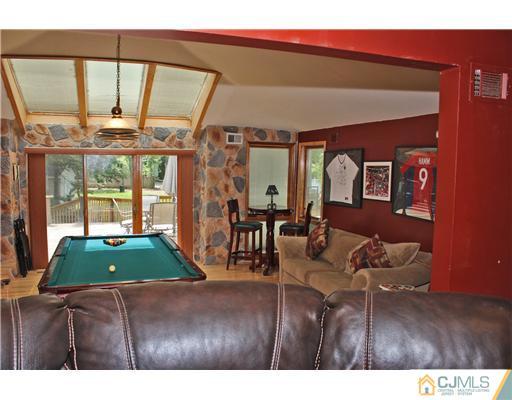 36 Runnymede Road Colonia, NJ 07067 - Photo 6 of 25 a living room with furniture and a large window