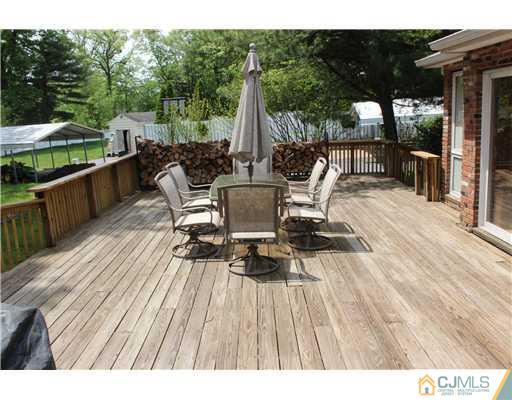 36 Runnymede Road Colonia, NJ 07067 - Photo 7 of 25 a view of deck with patio