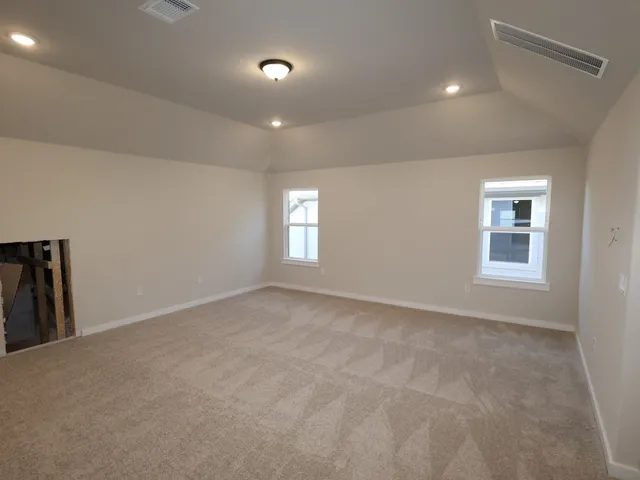 a view of empty room with windows