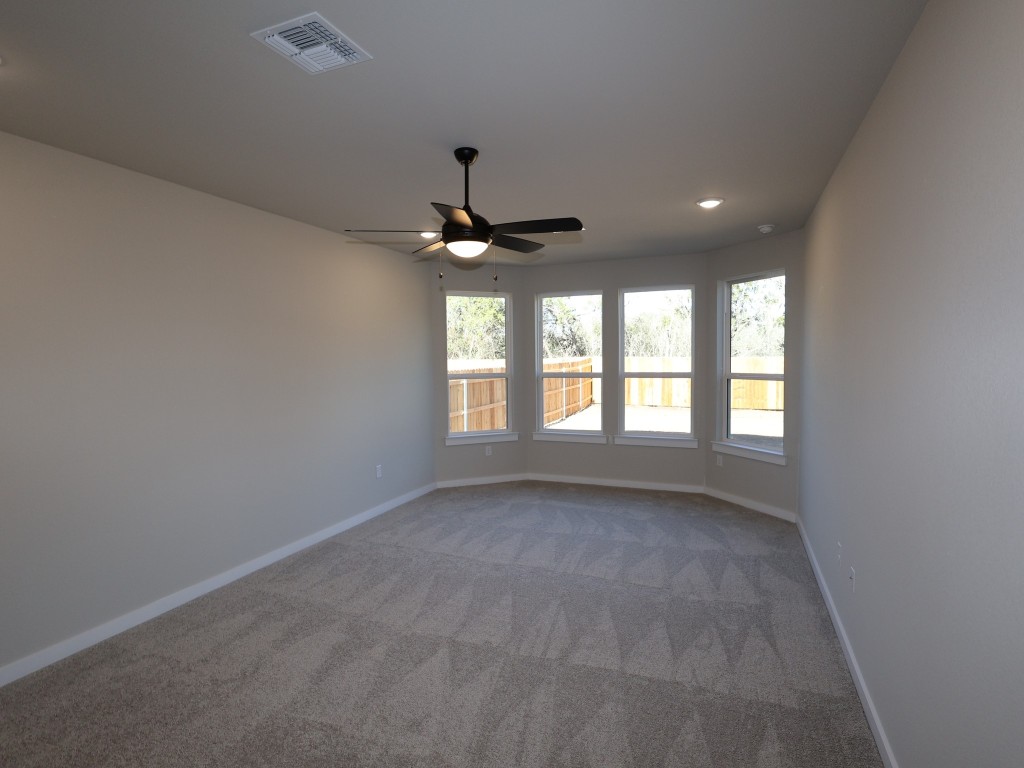 3713 Helena Way Leander, TX 78641 - Photo 8 of 28 a view of an empty room with a window