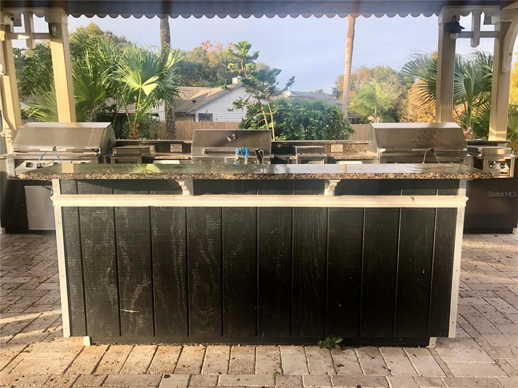 1049 South Hiawassee Road, Unit 3422 Orlando, FL 32835 - Photo 15 of 15 a kitchen with a sink and wooden cabinets