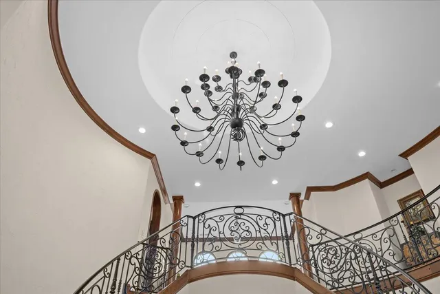 a dining room with furniture a rug and a chandelier