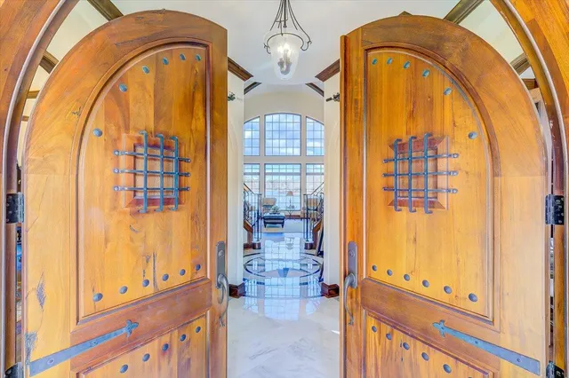 a living room with furniture a rug and a large window