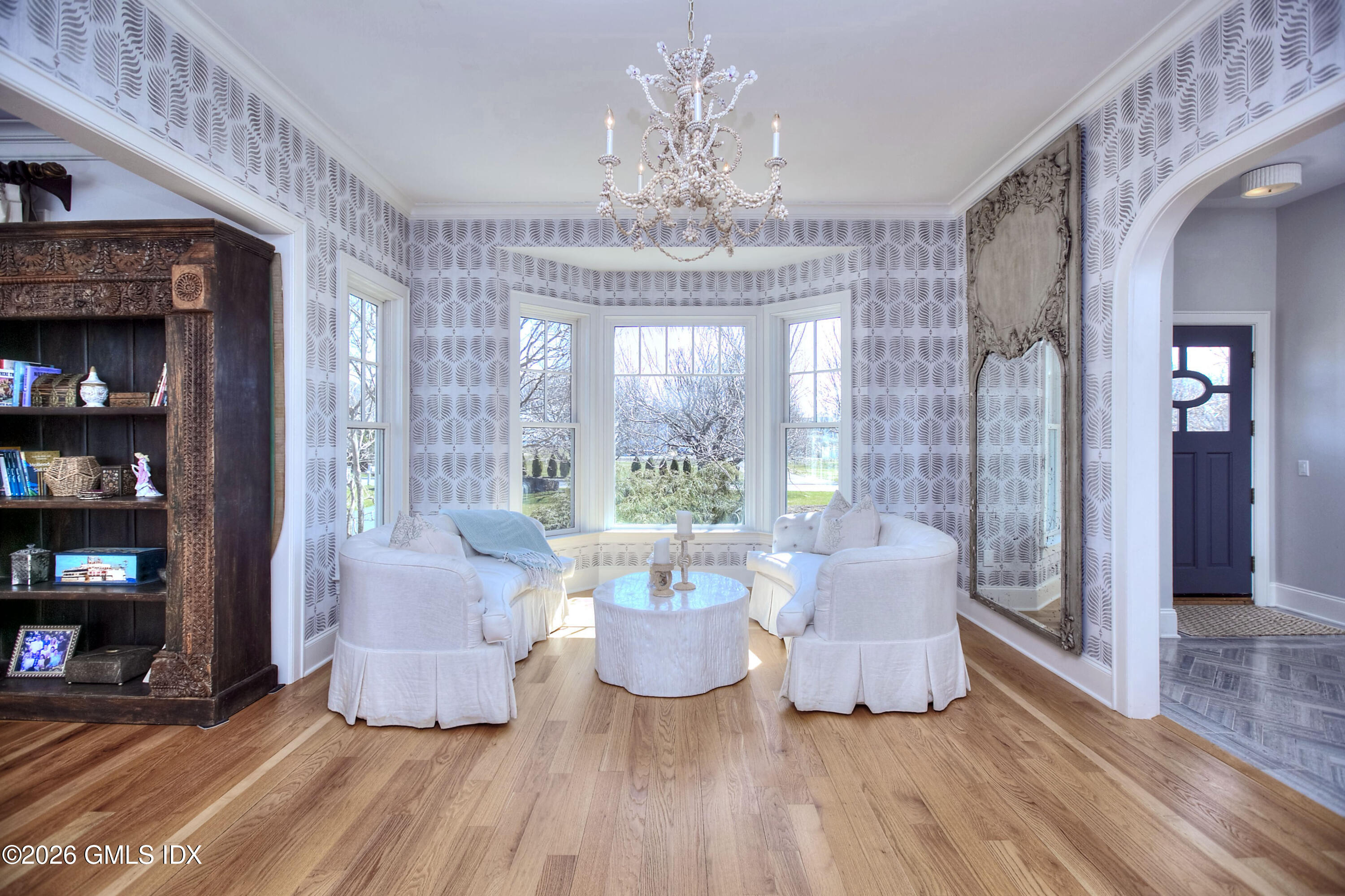 3 Shorehaven Road Norwalk, CT 06855 - Photo 6 of 40 a living room with furniture and a chandelier