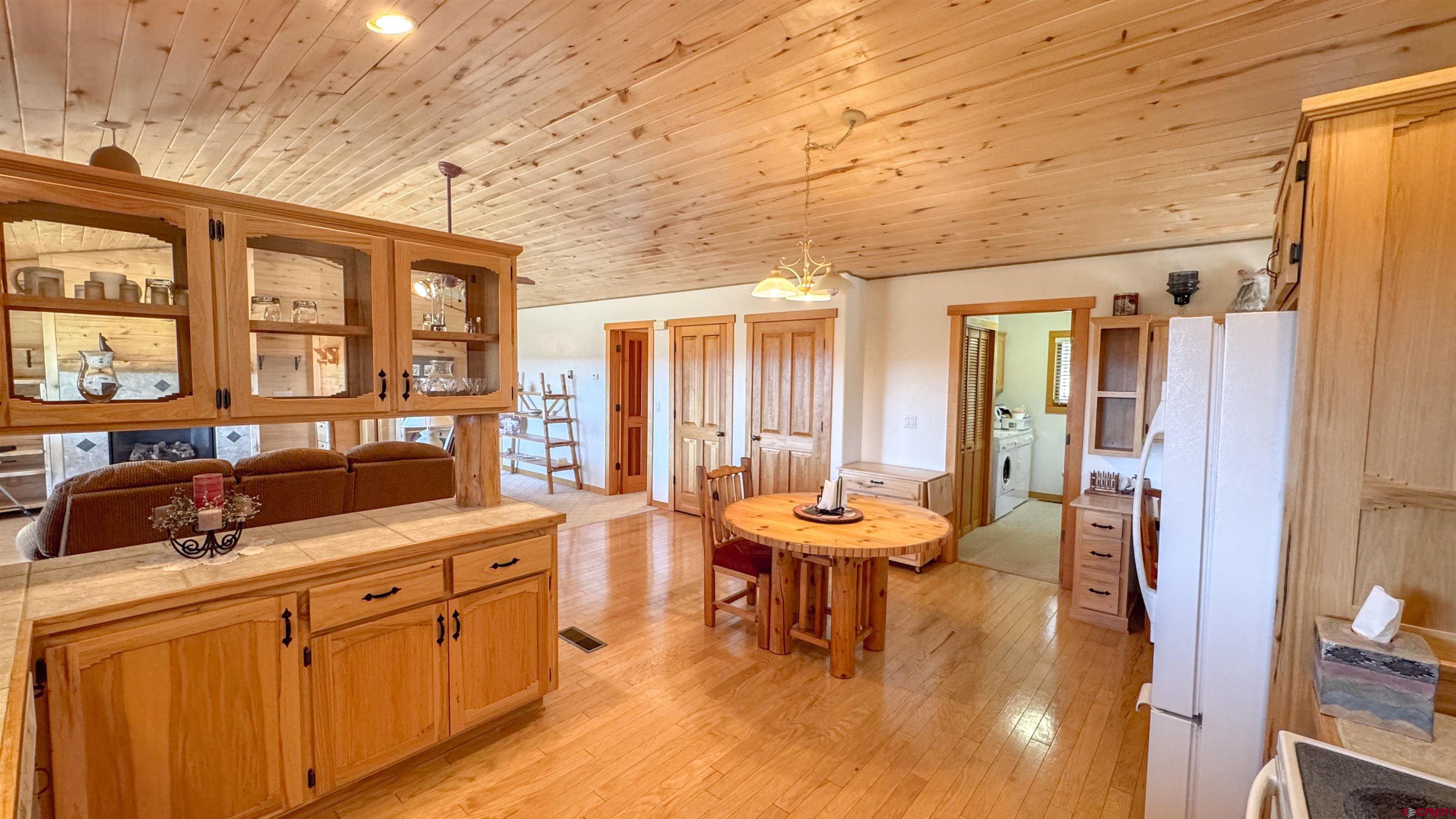 567 Double D Road Bayfield, CO 81122 - Photo 11 of 32 a large white kitchen with a large window