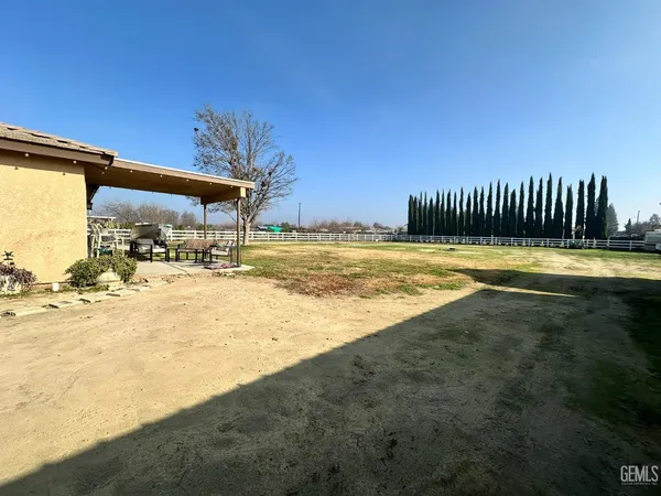 a view of a swimming pool with an outdoor space and seating area