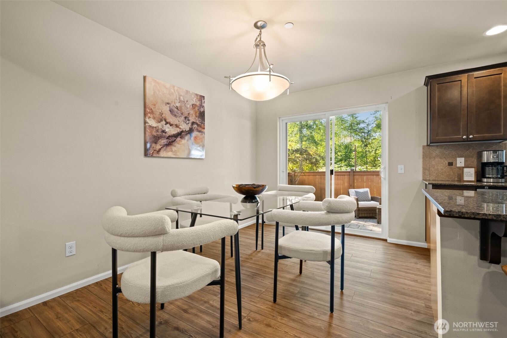 19312 1st Avenue West, Unit 4 Bothell, WA 98012 - Photo 13 of 32 a view of a dining room with furniture window and wooden floor