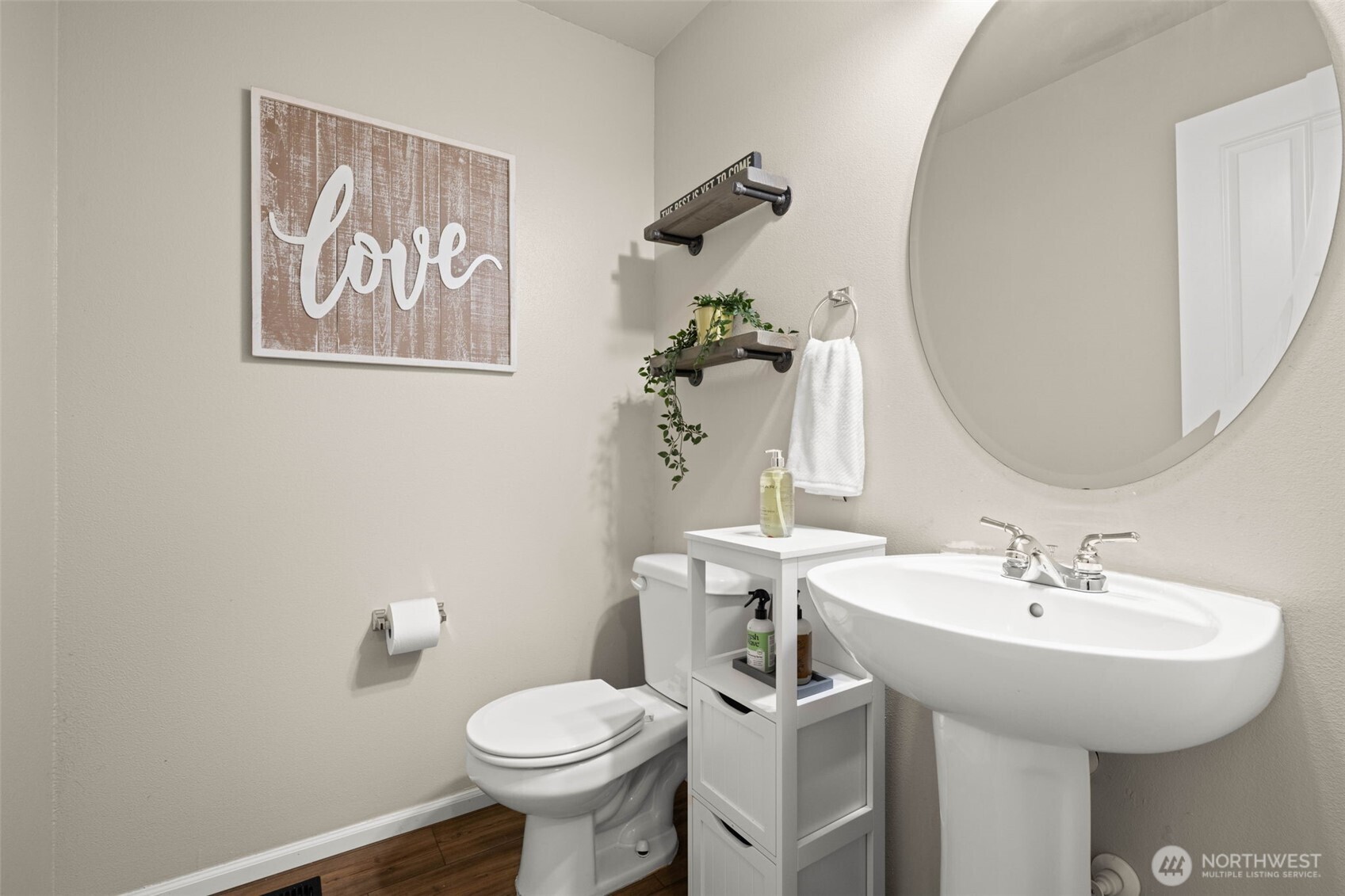 19312 1st Avenue West, Unit 4 Bothell, WA 98012 - Photo 14 of 32 a bathroom with a toilet sink and mirror