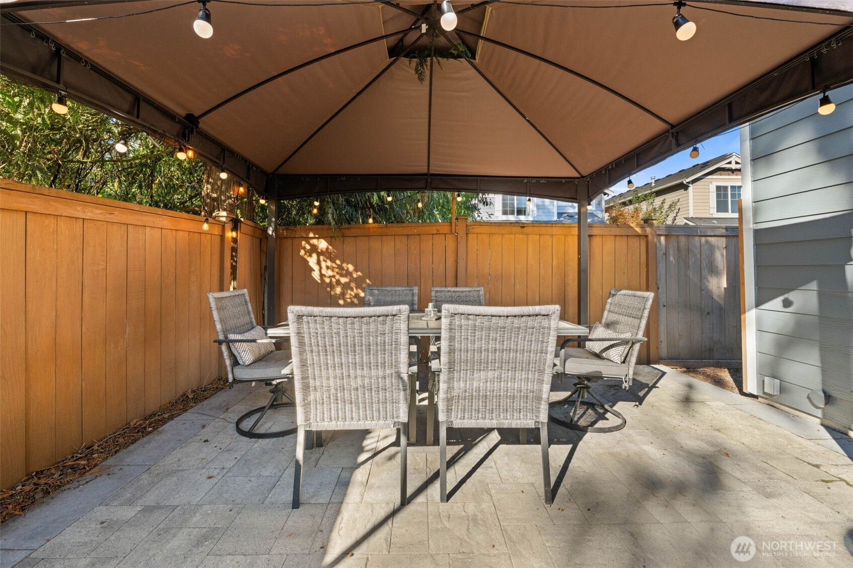 19312 1st Avenue West, Unit 4 Bothell, WA 98012 - Photo 17 of 32 a patio with a patio table and chairs