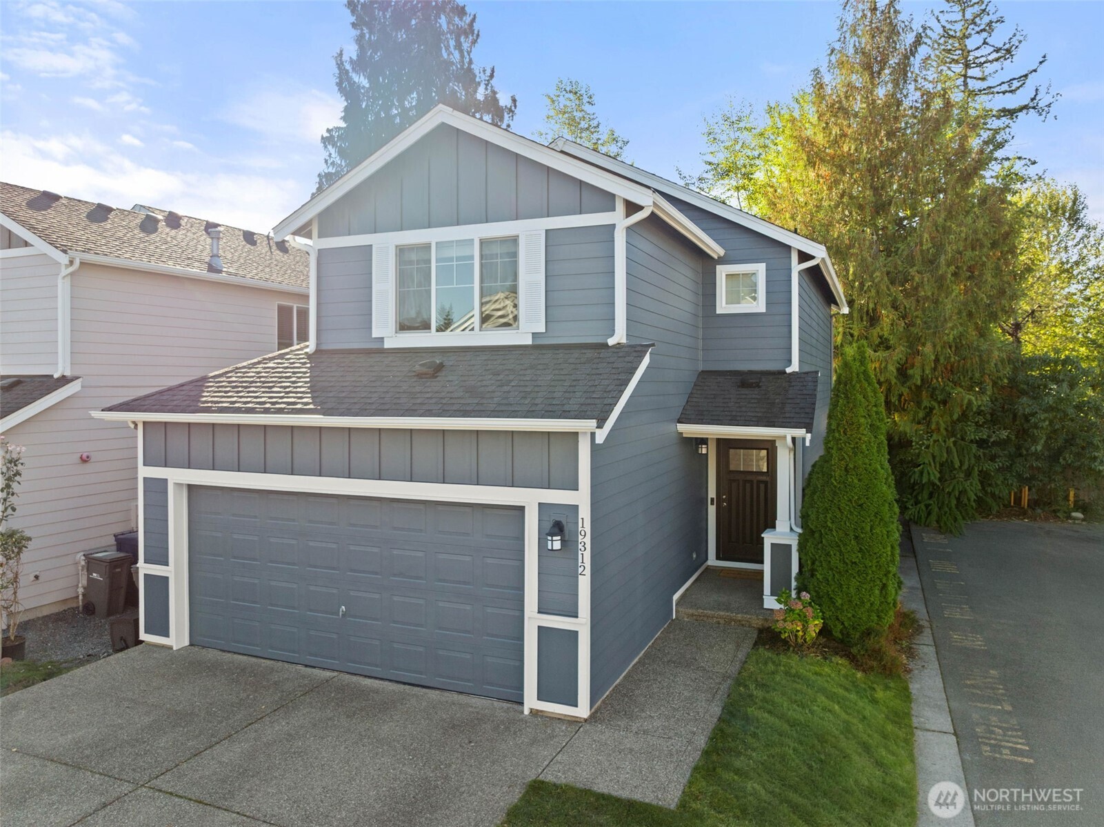 19312 1st Avenue West, Unit 4 Bothell, WA 98012 - Photo 2 of 32 a front view of a house with a garage