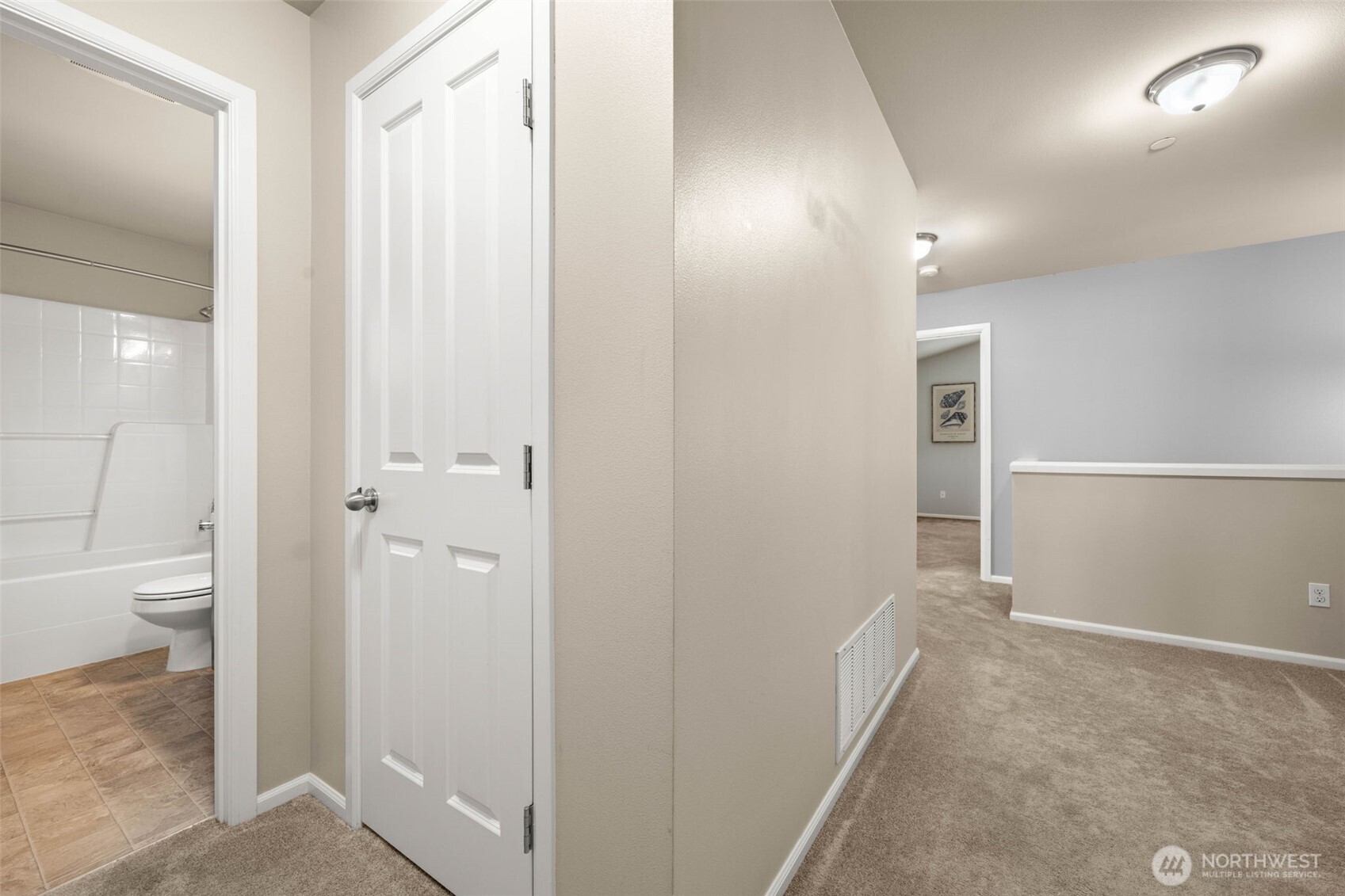 19312 1st Avenue West, Unit 4 Bothell, WA 98012 - Photo 22 of 32 a view of a bathroom with a shower and a toilet