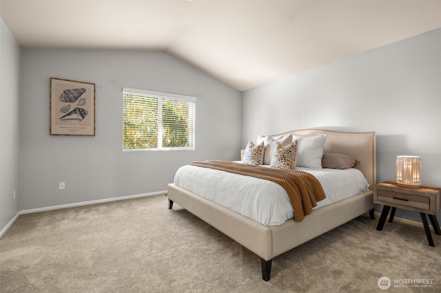 19312 1st Avenue West, Unit 4 Bothell, WA 98012 - Photo 25 of 32 a bedroom with a bed lamp and a window