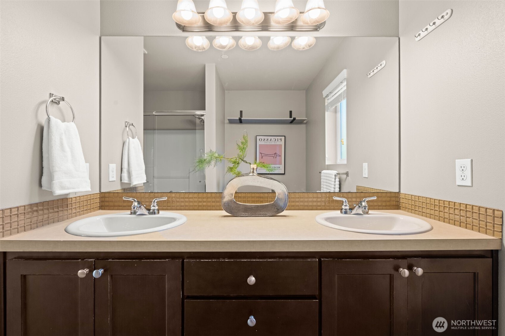 19312 1st Avenue West, Unit 4 Bothell, WA 98012 - Photo 29 of 32 a bathroom with a sink double vanity and a mirror