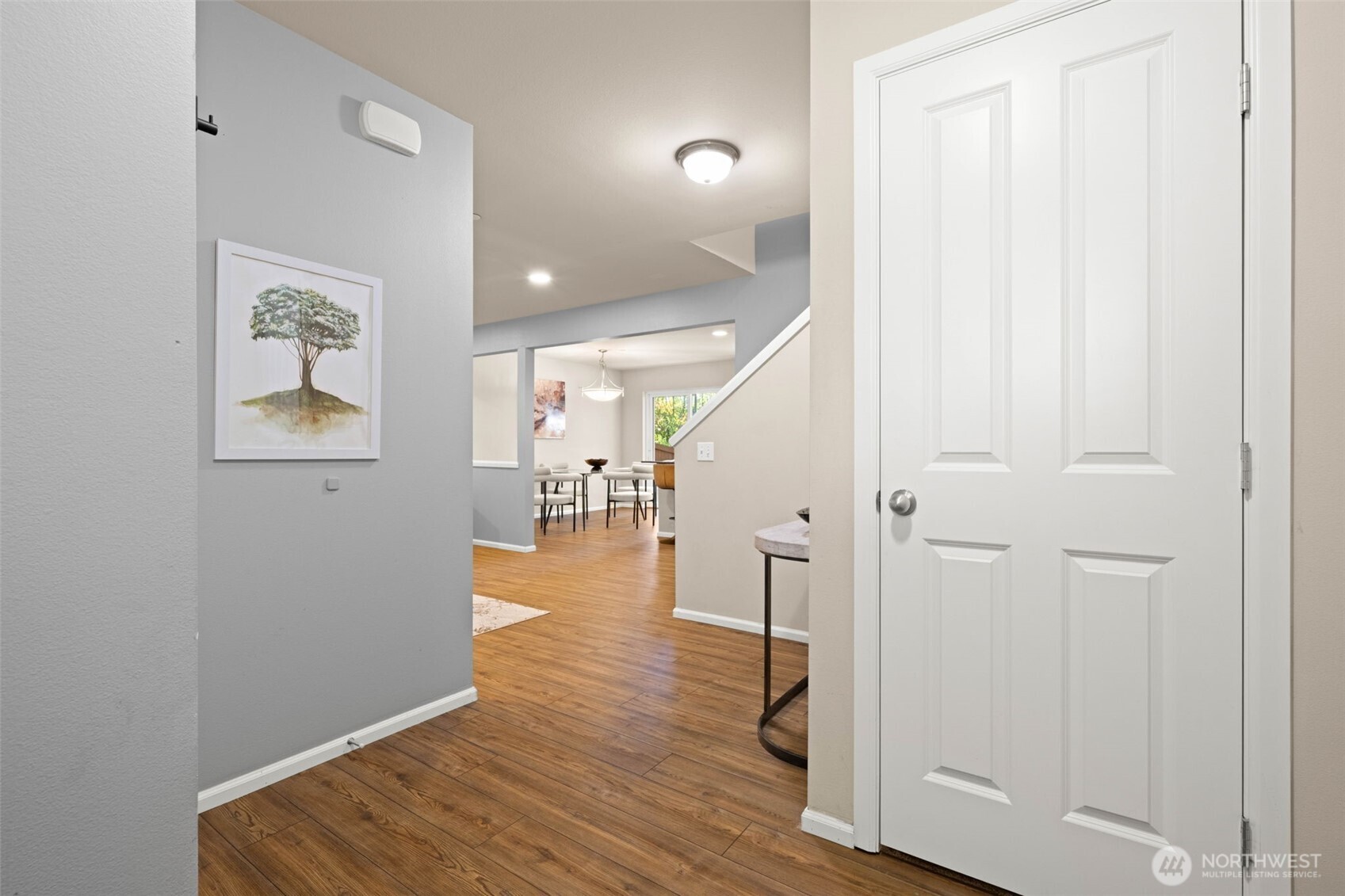 19312 1st Avenue West, Unit 4 Bothell, WA 98012 - Photo 3 of 32 a view of a hallway with wooden floor