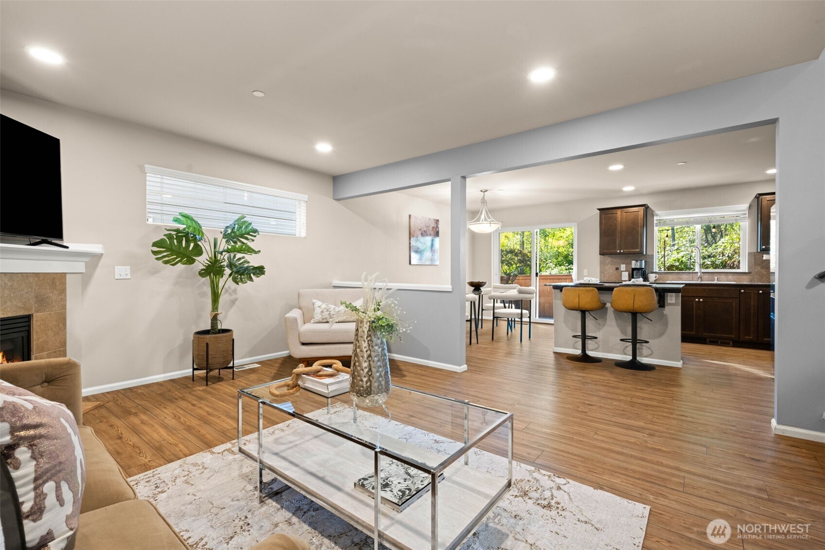 19312 1st Avenue West, Unit 4 Bothell, WA 98012 - Photo 5 of 32 a living room with fireplace furniture and a flat screen tv