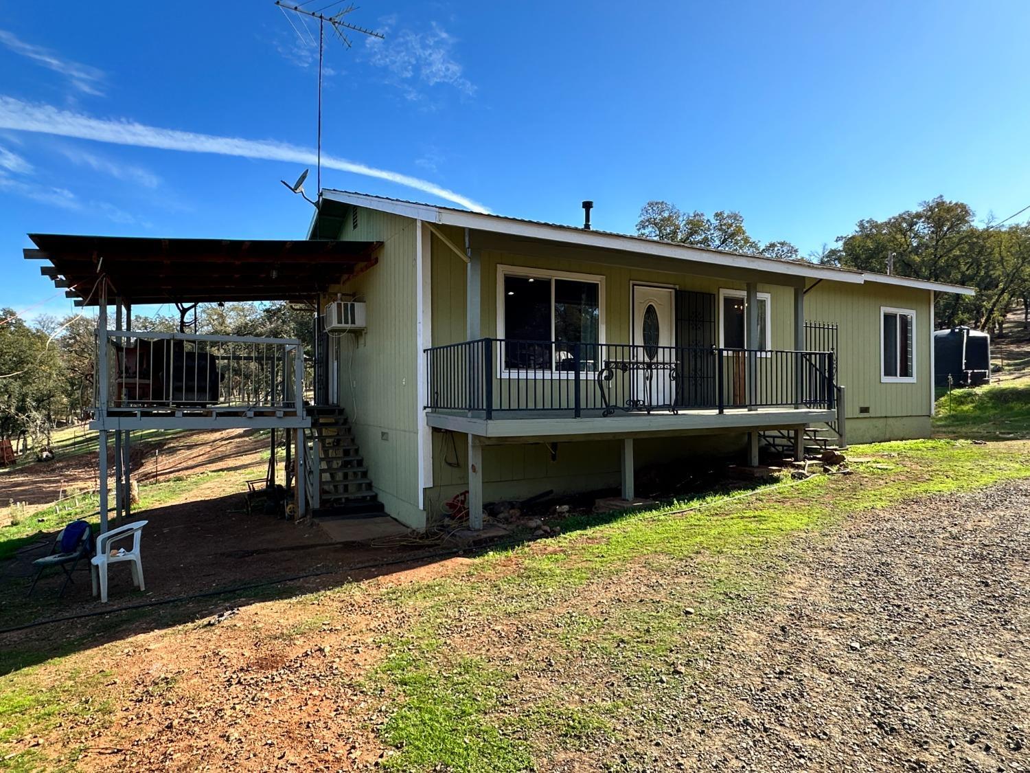 68 Reginald Way Oroville, CA 95966 - Photo 1 of 12 a view of a house with backyard and sitting area
