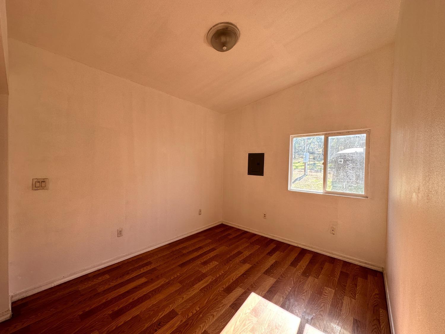 68 Reginald Way Oroville, CA 95966 - Photo 5 of 12 a view of a room with wooden floor and window