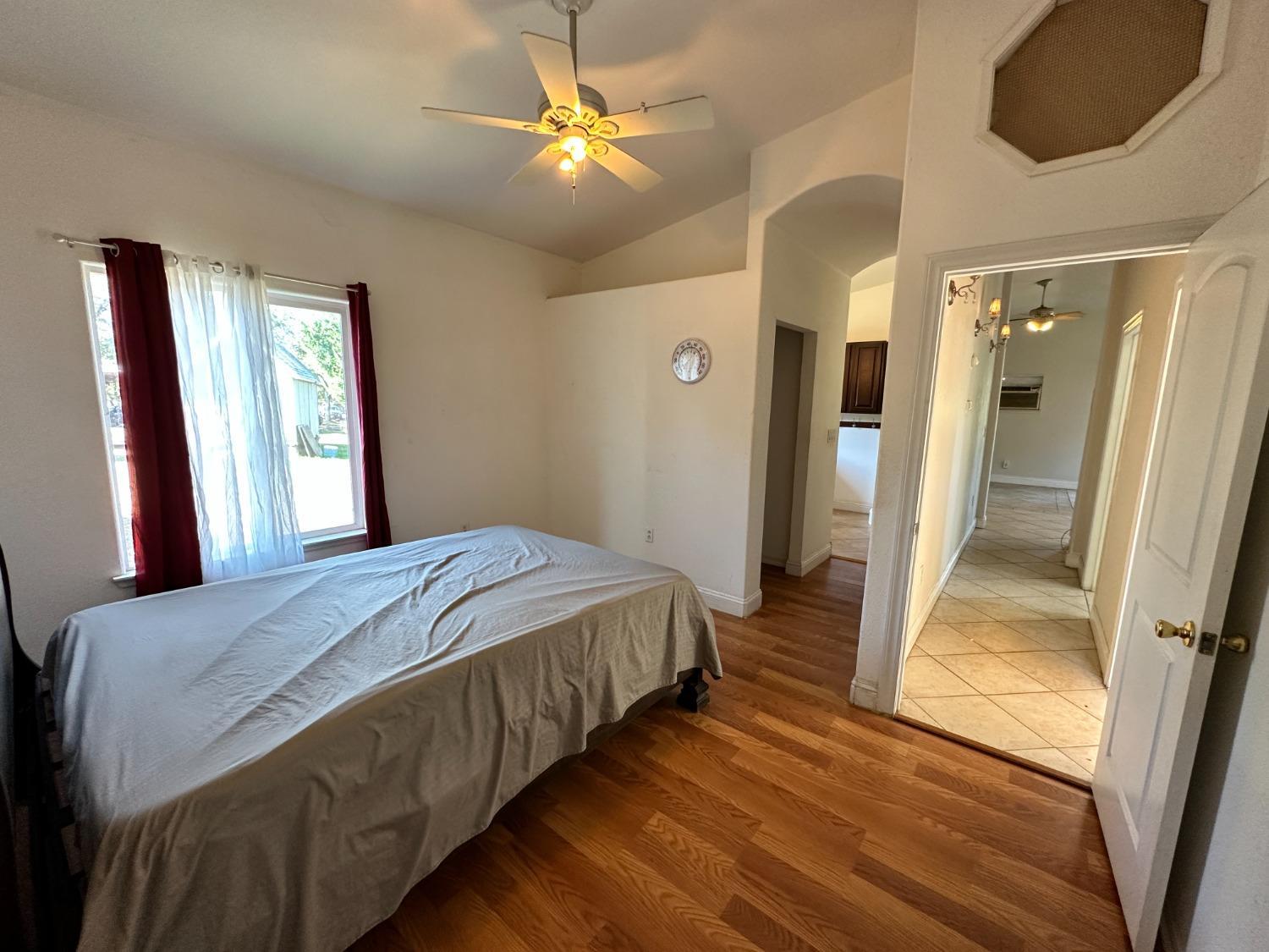 68 Reginald Way Oroville, CA 95966 - Photo 9 of 12 a bedroom with a bed and a chandelier