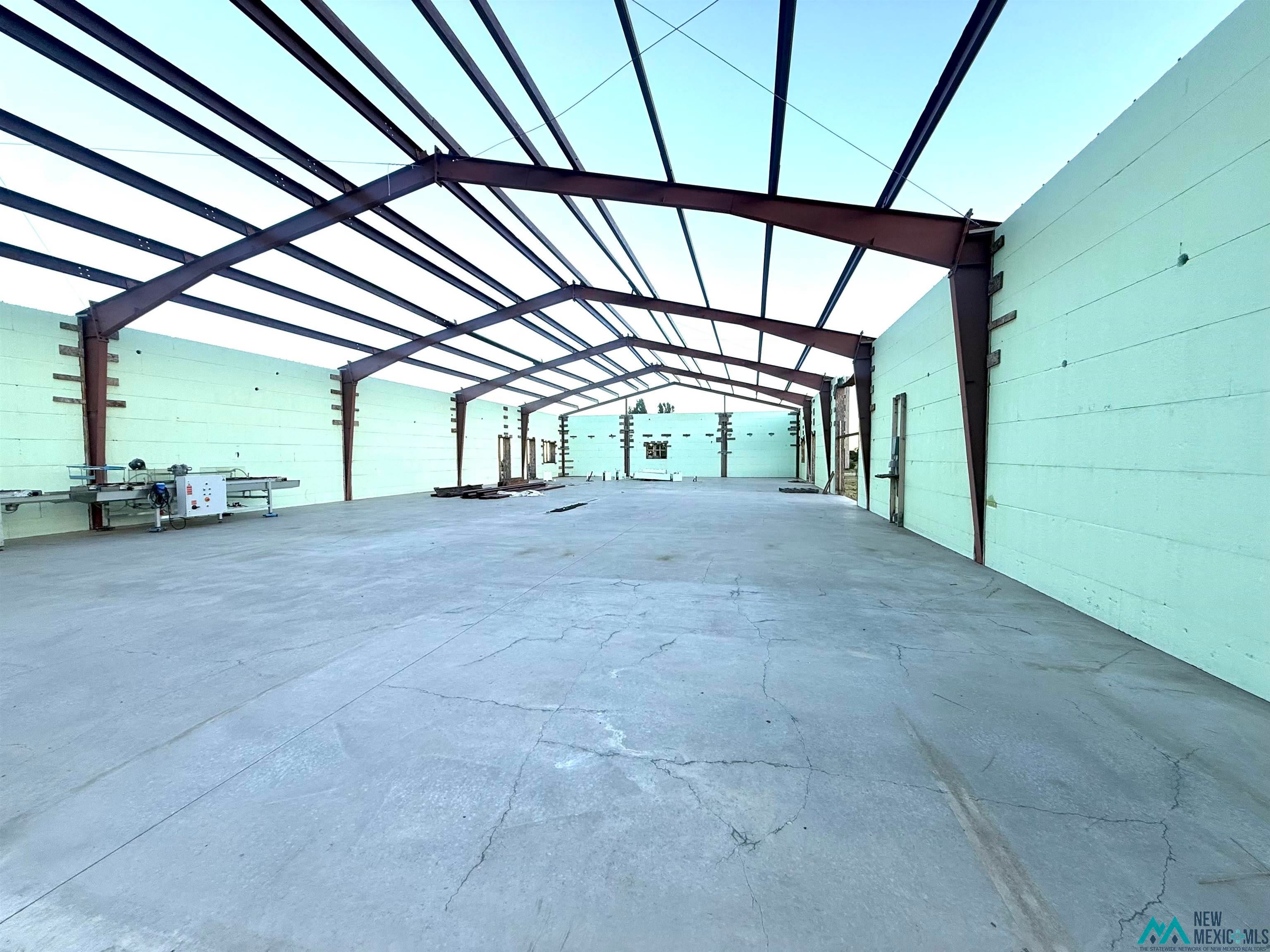 25 Linwood Road Raton, NM 87740 - Photo 8 of 41 Expansive interior space featuring a concrete slab floor and exposed structural steel framing