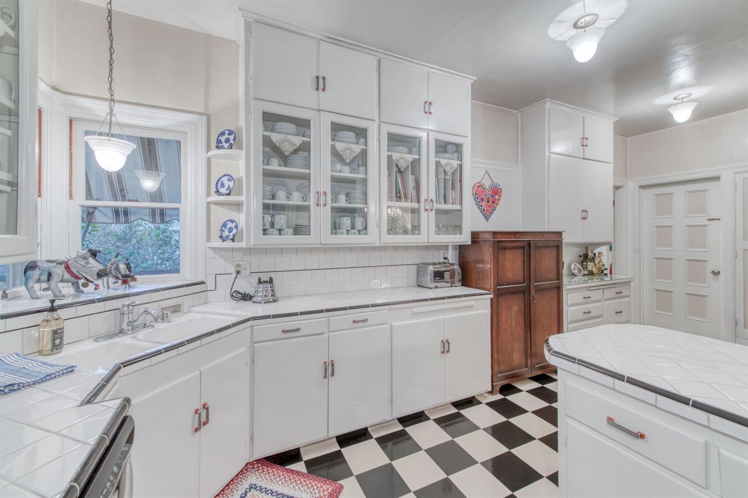 560 East Clinton Avenue Fresno, CA 93704 - Photo 16 of 49 a kitchen with a sink stove and refrigerator
