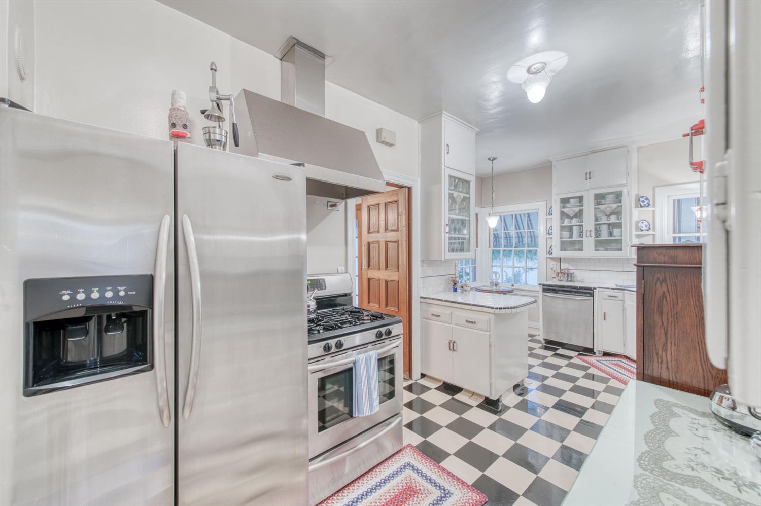 560 East Clinton Avenue Fresno, CA 93704 - Photo 17 of 49 a kitchen with stainless steel appliances a refrigerator sink and stove