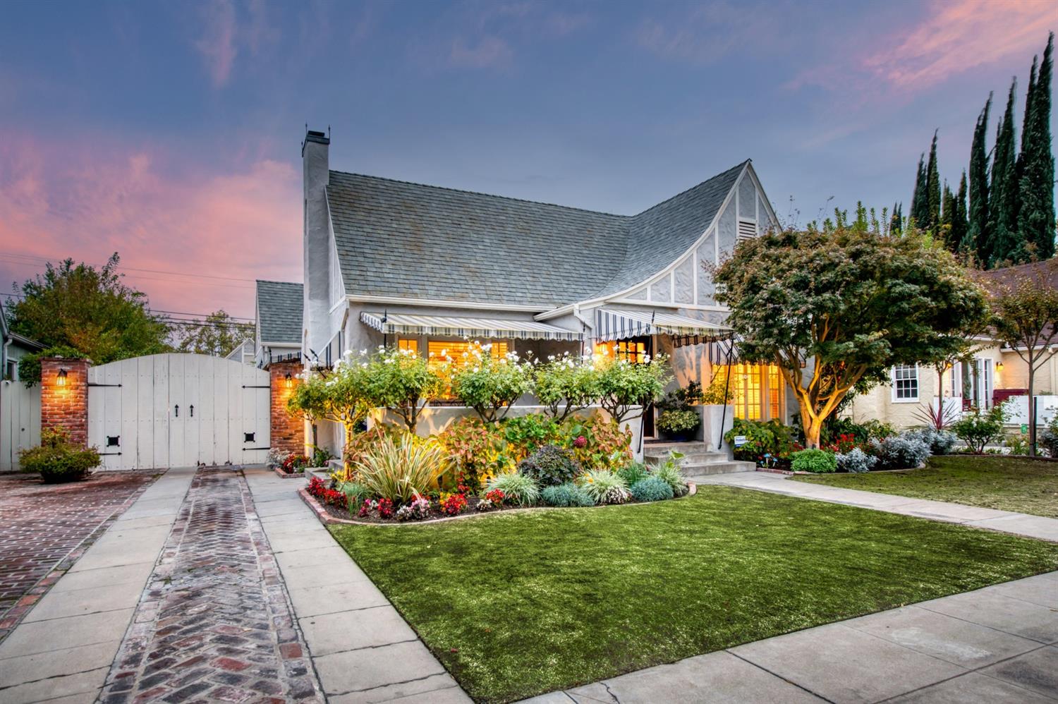 560 East Clinton Avenue Fresno, CA 93704 - Photo 42 of 49 a front view of a house with a garden and plants