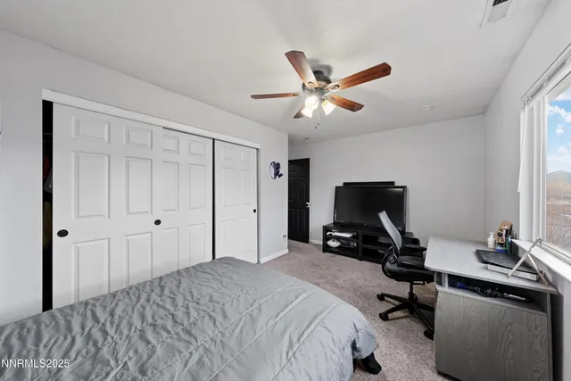 a bedroom with a workspace