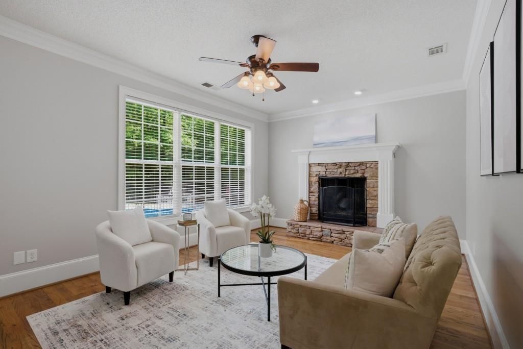 582 Knox Chapel Road Social Circle, GA 30025 - Photo 15 of 49 a living room with furniture a fireplace and a table