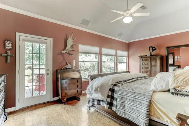 a bed room with a bed and a chandelier
