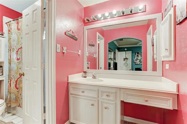 a bathroom with a sink a mirror and a shower