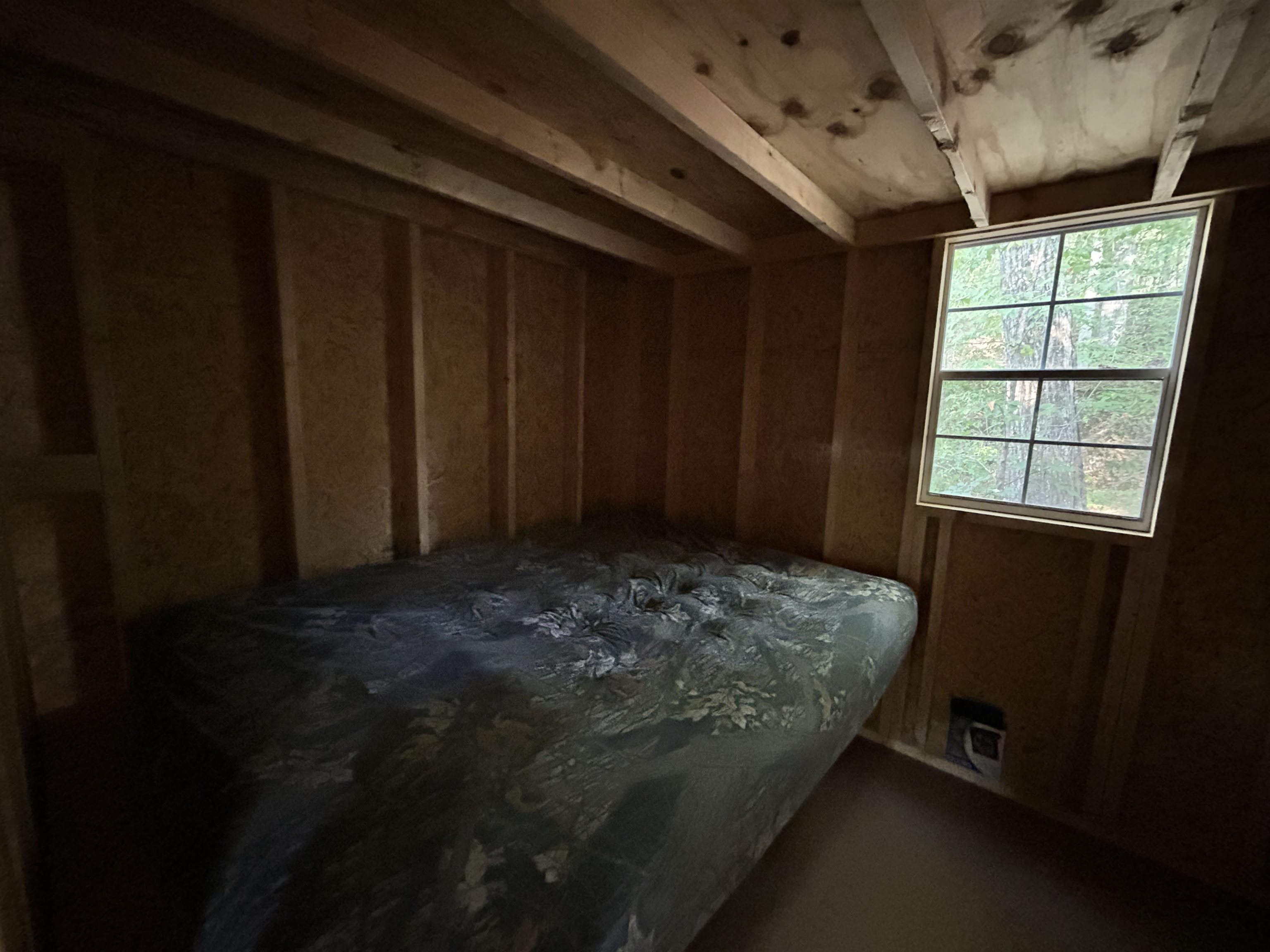 0 Cora Lane Bolivar, TN 38008 - Photo 9 of 24 a bedroom with a bed and a window