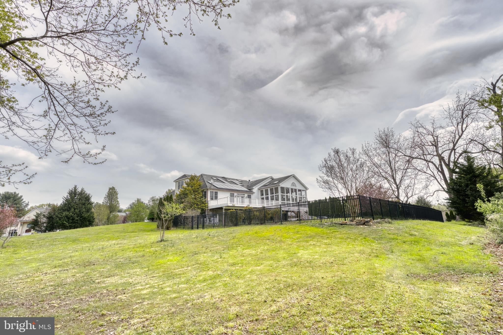 39 Riverside Drive Elkton, MD 21921 - Photo 7 of 64 a view of swimming pool of water with lawn chairs and large trees